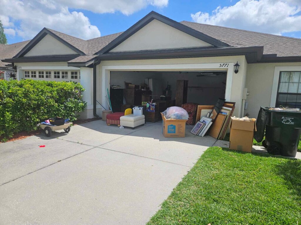 Junk Removal Services 2 Crew cleaning out a cluttered garage in Bradenton, FL