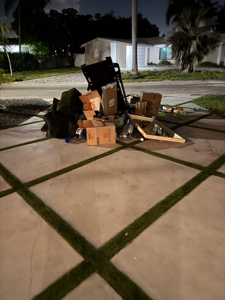 Junk removal pile on driveway in Sarasota, FL