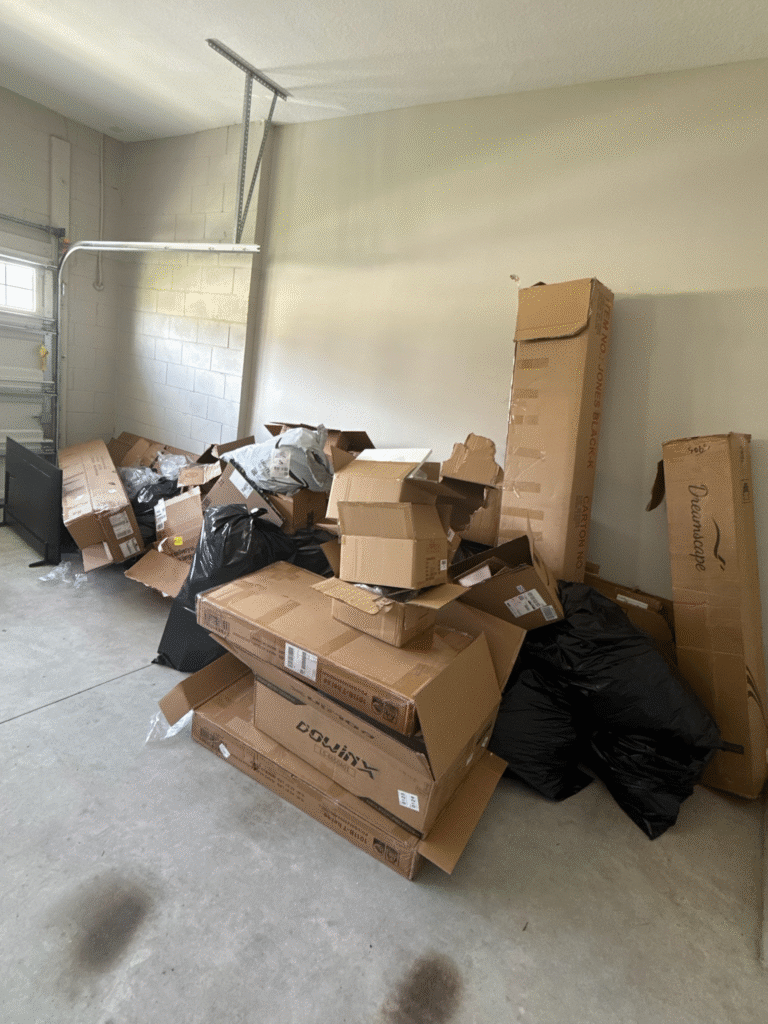 Pile of junk and debris in a garage to be removed by Move It Junk Removal