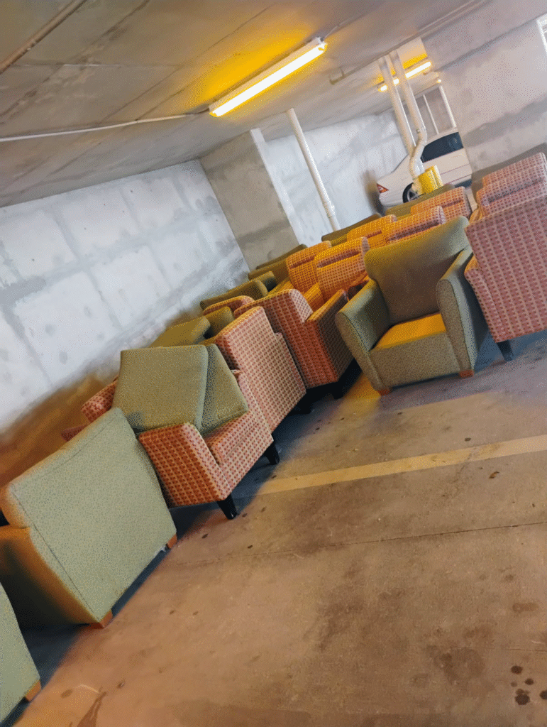 Chairs in a parking garage to be removed by Move It Junk Removal Tampa