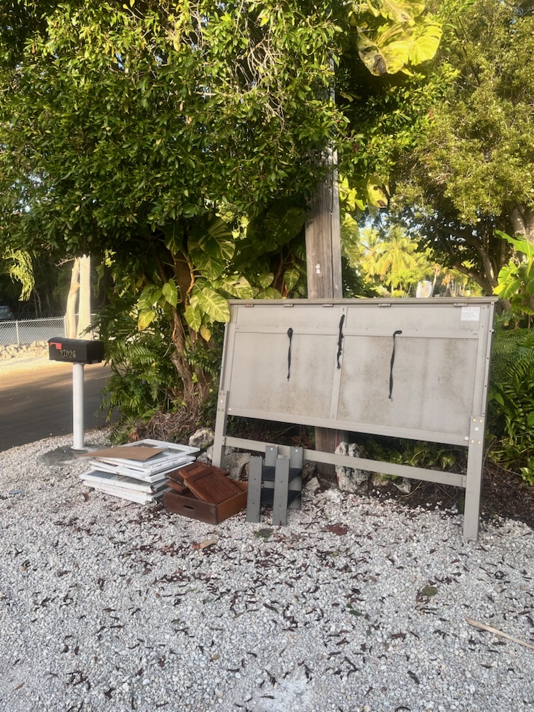 Old bed set out for junk removal in Sarasota